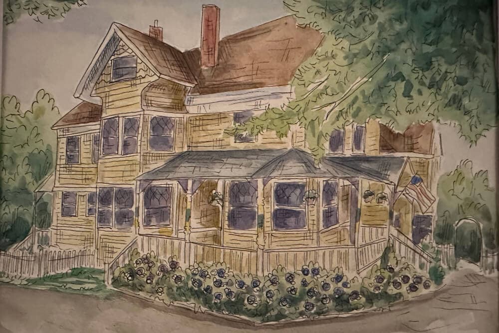 Watercolor illustration of a large, yellow Victorian house surrounded by trees and flowers.